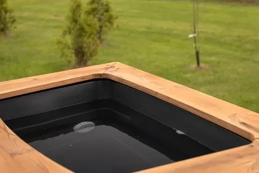 The deep grey plastic interior highlights the timeless design of the tub.